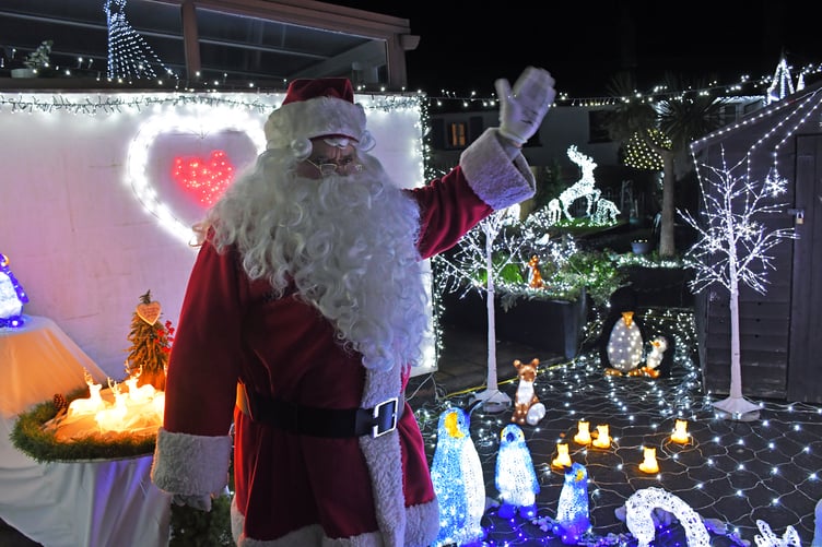 Father Christmas helped to switch on the festive lights display at Elliot's Touch, in Watchet. PHOTO: Peter Mather.