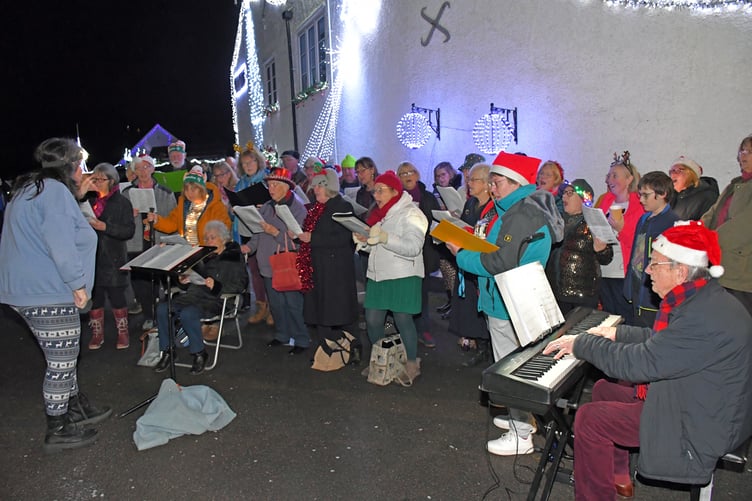 Carol singing as Elliot's Touch Christmas lights are turned on in Watchet. PHOTYO: Peter Mather.