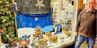 Charity shop window funfair stops passers-by