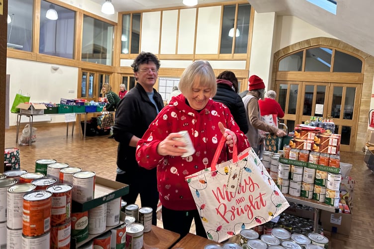 Volunteers at the West Somerset Food Cupboard packing food bags. PHOTO: WSFC.