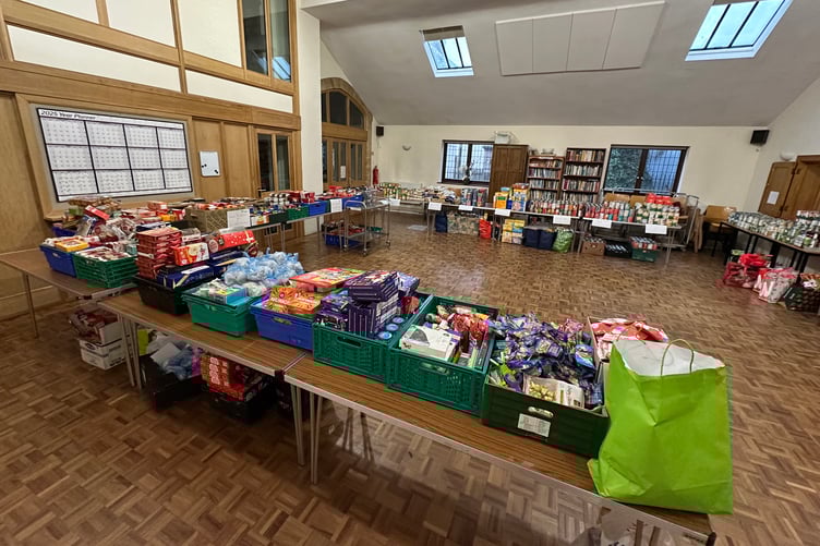 Food items laid out waiting to be packed into parcels by West Somerset Food Cupboard volunteers. PHOTO: WSFC.