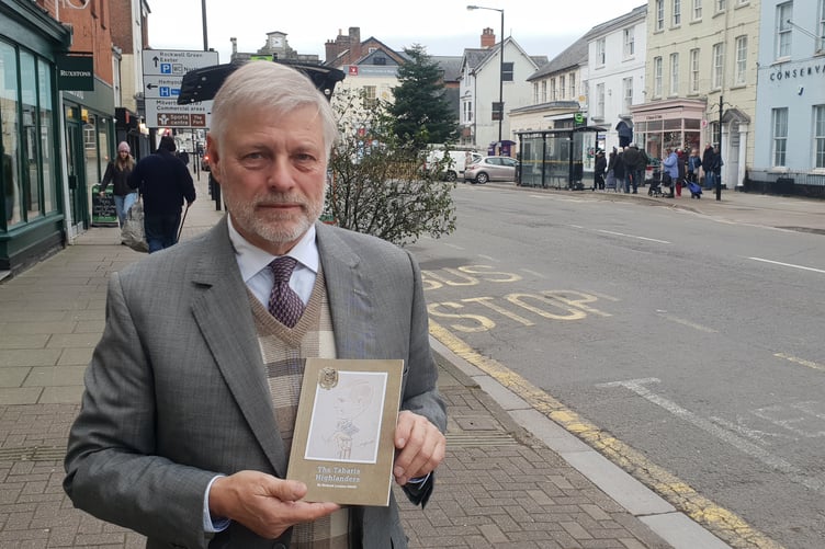 Richard Loraine-Smith with his book The Tabaris Highlanders 1939.