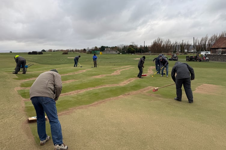 Clearing the 18th green at Minehead