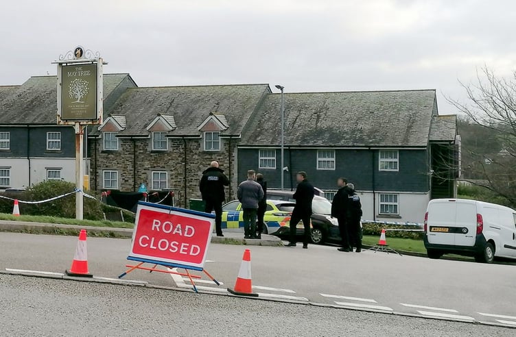 Police at the scene in Helston where the discovery of man's body in car has sparked a murder probe. Release date December 19, 2024. Two women - including one in her 80s - have been arrested on suspicion of murder and concealing the body of a victim. The suspects were detained after a murder probe was launched after the body of a man was found in a vehicle at the Helston Business Park in Cornwall. Police were making enquiries in the Helston area in the early hours of Wednesday 18 December following concerns for welfare. A man in his 60s, from the Somerset area, was confirmed dead at the scene. His next of kin have been informed. Two women aged in their 50s and 80s, also from Somerset, have been arrested on suspicion of murder, concealing a death, and preventing a lawful burial. They remain in police custody at this time.