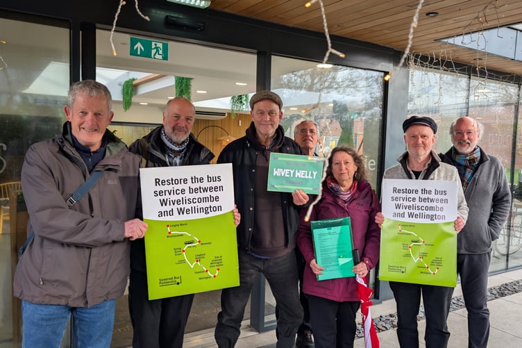 Members of bus users groups in Wellington and Wiveliscombe present a petition calling for restoration of a bus between the two towns.