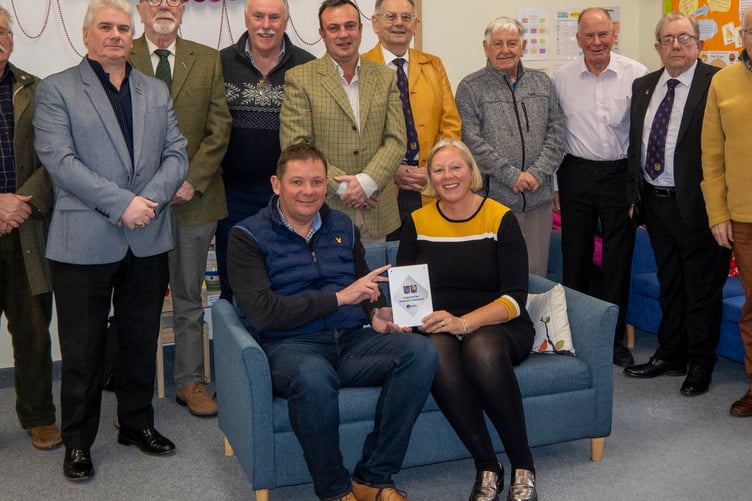 Freemasons from Quantock (Watchet) and Exmoor (Minehead) Lodges present a grant to Home-Start West Somerset manager Clare Pound for the Dad Matters project. PHOTO: Chris Moore.