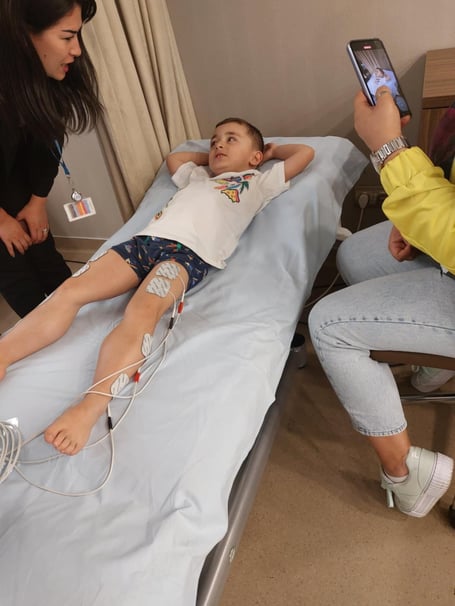 Aleksander Simeonov in hospital. A desperate family is trying to raise £3m for miracle "one time" treatment to save their six-year-old son's life. Brave little Aleksander Simeonov with diagnosed with Duchenne Muscular Dystrophy (DND) in April - after suffering from a tight Achilles tendon and issues with the alignment of his hips. The rare, life-threatening condition - which predominantly affects boys - causes muscle deterioration affecting the skeletal, heart, and lung muscles. Without stem cell therapy, the degenerative condition will rob Aleks of the ability to walk, and shortens his life expectancy to just 20 years-old. 