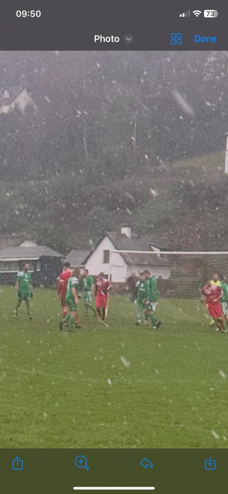 Snow falls during Porlock and Redgate game