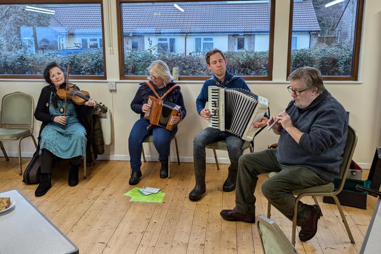 Musicians from Allerford Community Orchard Group entertain after the annual wassail.