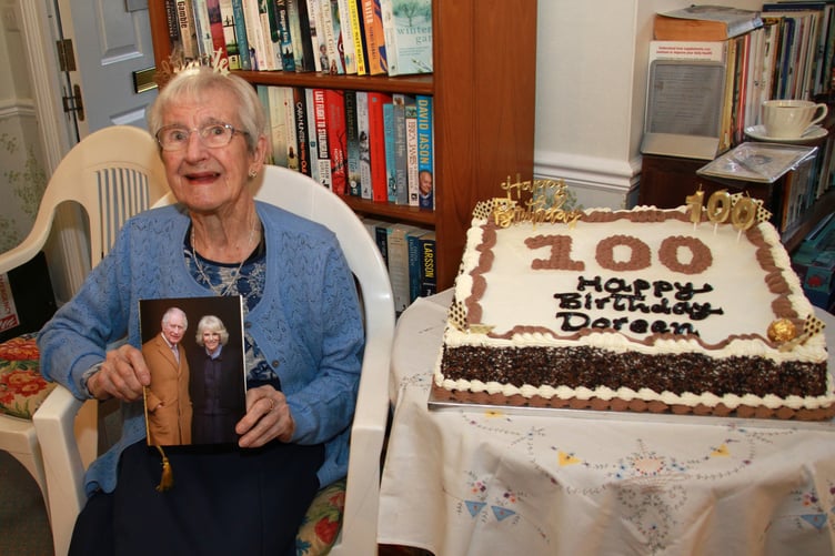 Minehead's Doreen Atkin with a card from the King and Queen celebrating her 100th birthday. PHOTO: George Ody.