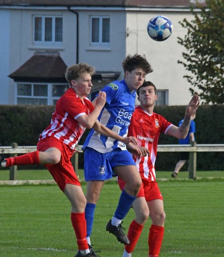 Will Singleton-Voss (in blue) - always 'busy' for Minehead