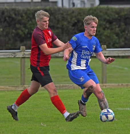 Josh Elston (in blue) - scored equaliser for Minehead