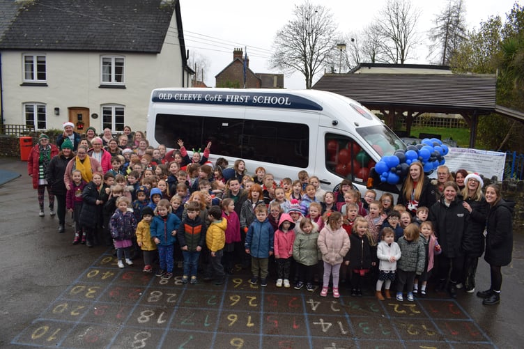 Staff and pupils of old Cleeve First School, Washford, celebrate the delivery of a minibus after a year-long fund-raising campaign.