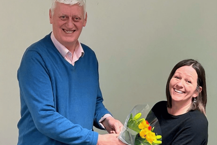 Moorland Food Bank chairman John Prescott makes a farewell presentation to Ali Sanderson.