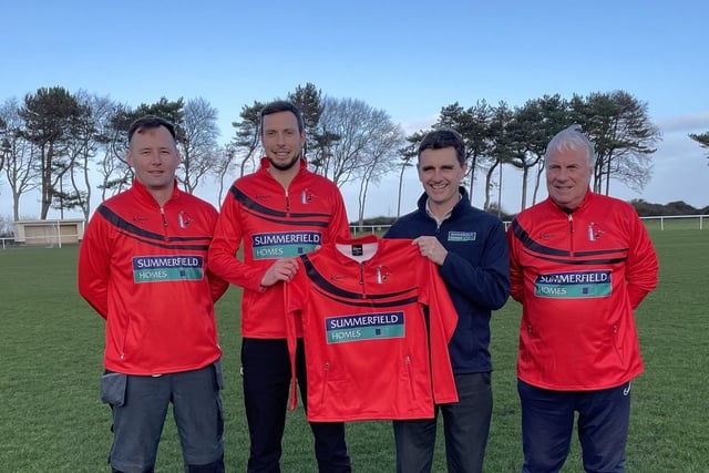Watchet Town players Connor Jeromson and Eben Harding (capt), with Philip Morgan, Somerfield Homes Sales Marketing Director, and Nick Sully, a member of the club's management committee.