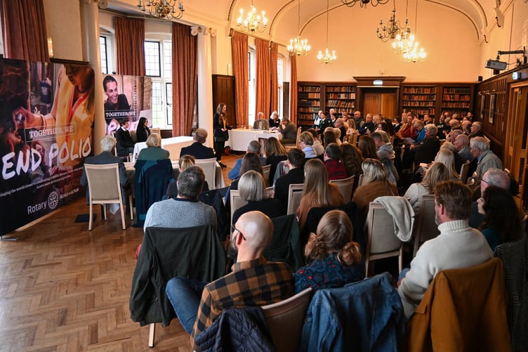 An audience in Taunton School listens to local school pupils taking part in a Rotary debating competition.