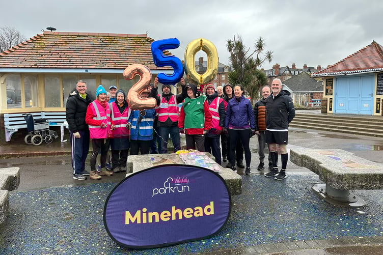 Family and friends celebrate 250 Minehead Parkruns completed by 85-year-old Dunster resident Mike Capel (in green tabard).