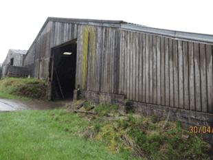 Plan to build four new homes in farmyard