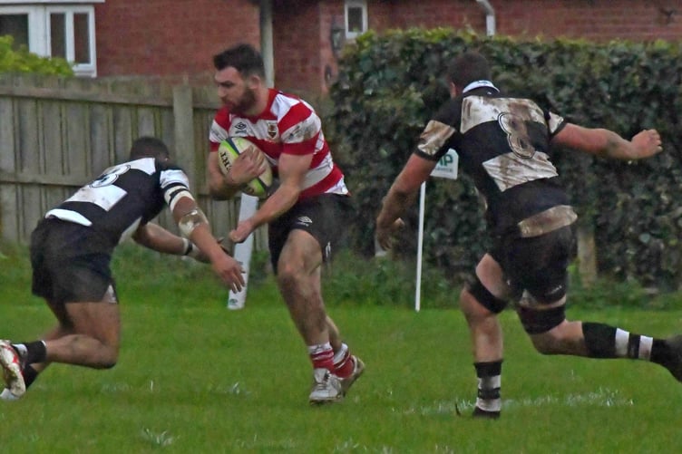 Minehead Barbarians (black hoops) in action against Midsomer Norton at home in November