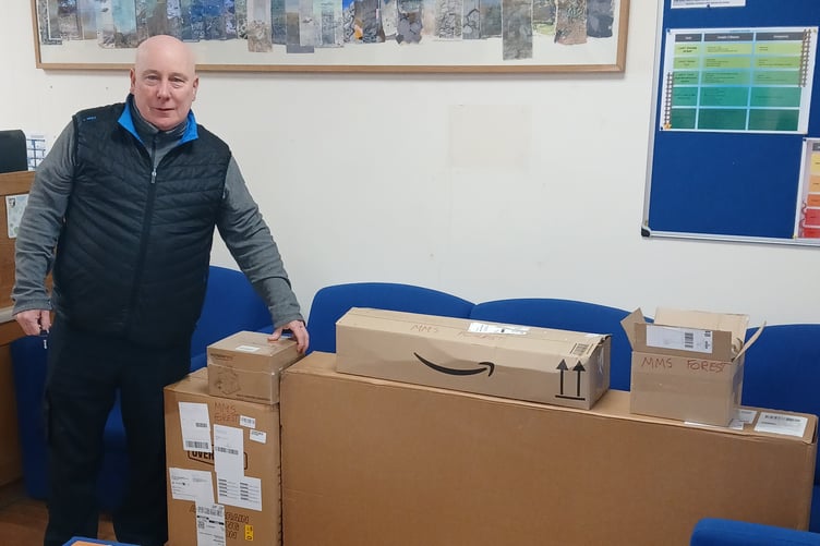 Minehead Middle School forest school lead Billy Mcneilly takes delivery of new equipment provided by Poppins.