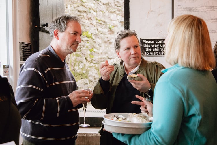Thies and Chris Burdorf, of the Lion Hotel, Dulverton, try oysters at the launch of tis year's Eat Exmoor guide. PHOTO: Daffodil PR.