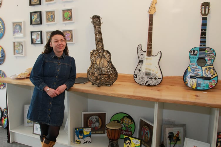 Kerry Johnson in her Minehead gallery The Kontinuum with musical instruments made from scrap by Stephen Heard. PHOTO: George Ody.