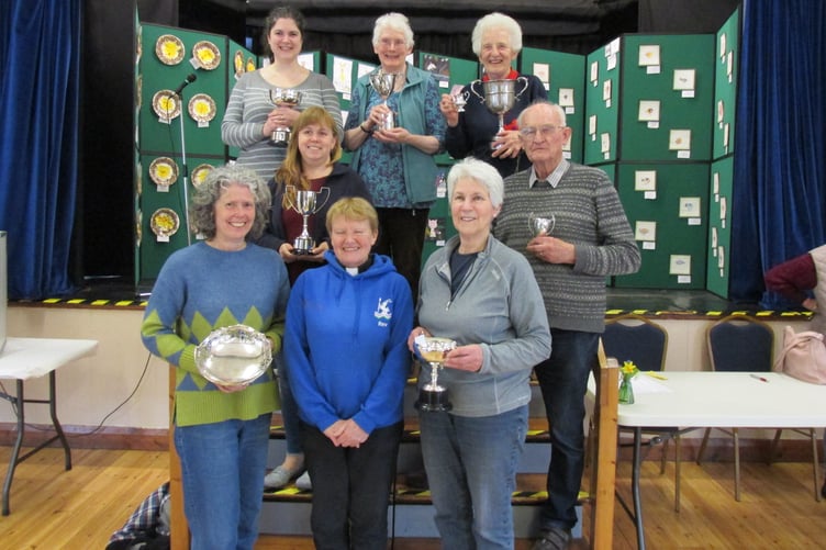 The Rev Ann Gibbs (front, centre) is pictured with Porlock Horticultural and Crafts Society Spring Show cup and trophy winners (back row) Catherine Greer, Sue Appleton, Pauline Garfield, (middle) Caroline King, Peter Leather (front) Wendy Pettitt, Rosalinde Haw. Children’s winner Behr Adlington and Madeline Little were not present.