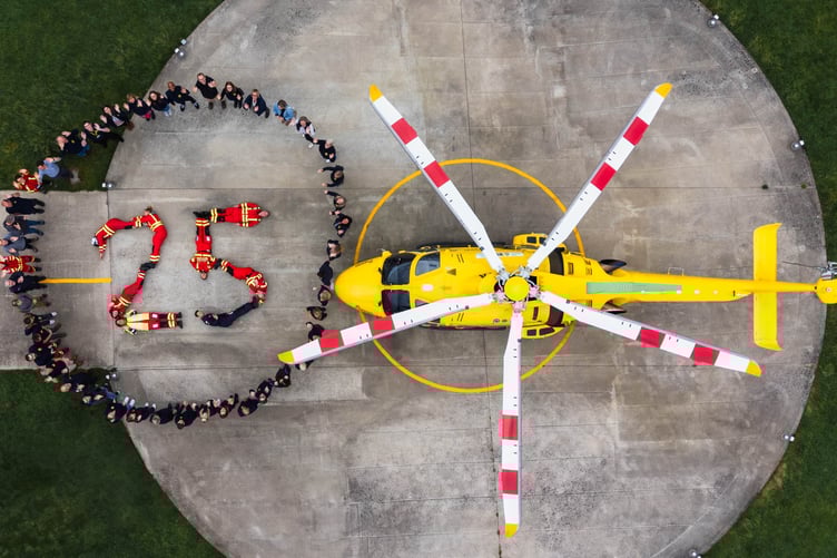 Dorset and Somerset Air Ambulance crew shape the number 25 for the charity's anniversary. PHOTO: DSAA.