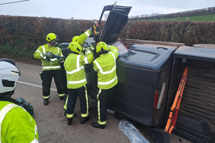 An Isuzu pick-up truck overturned in Wiveliscombe, and the driver was rescued by firefighters. PHOTO: DSFR.