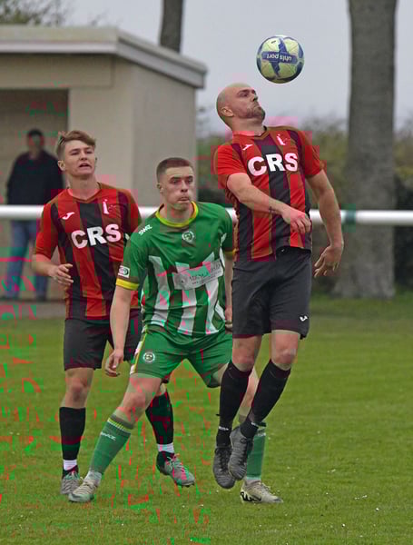 Brandon Walsh heads clear for Watchet Town against Worle last weekend