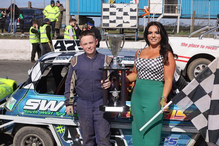 Mason Sealy is presented with the Irish Open trophy after his success at Nutts Corner