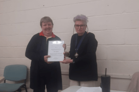 Watchet Salvation Army's  Samantha Searle receives her volunteer of the year award from town mayor Cllr Loretta Whetlor.
