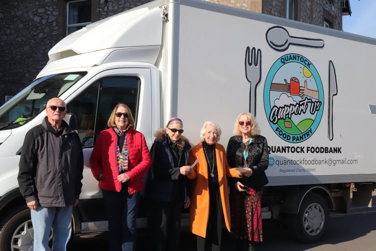 Photograph shows (left to right) Quantock Foodbank volunteers Allan King and Anna Thomas, foodbank manager Marlene Mason, Watchet Street Fair organiser Molly Quint, and St Margaret Hospice Watchet shop manager Claire Sawyer.