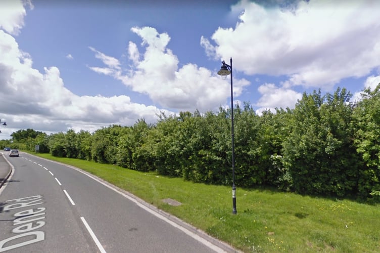 Planned entrance to new development of 80 homes and takeaway outlet on Dene Road in Cotford St. Luke