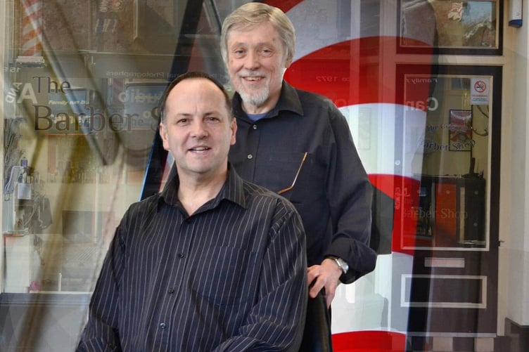 Stuart Newsham (seated) with Steve Winter, of Minehead barber shop Something for the weeke