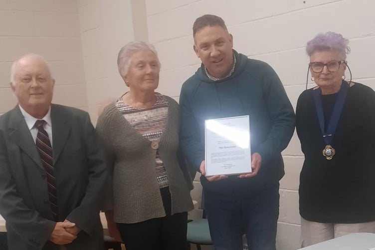 Watchet Mayor Cllr Loretta Whetlor presents the Millington Shield for best charitable organisation to The Sanctuary.