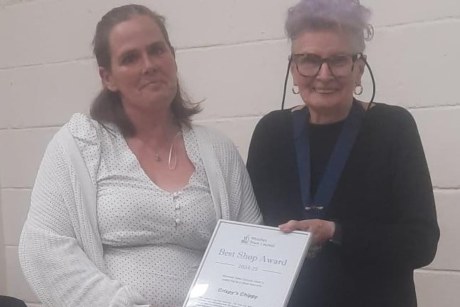 Crispy's Chippy receives the award for best shop from Watchet Mayor Cllr Loretta Whetlor (right).