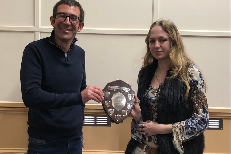West Somerset Brass Band musical director Niall Watson presents Jasmin Dunn with the most improved player award. PHOTO WSBB.