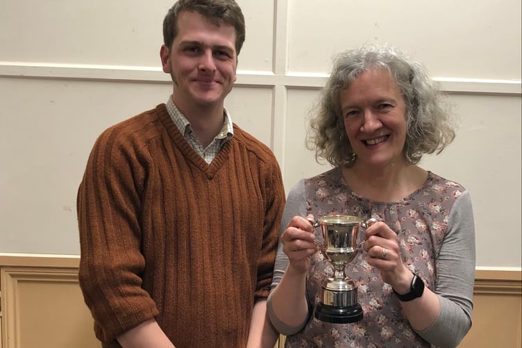 West Somerset Brass Band training band conductor Kieren Berry presents the most improved member award to Amanda Hedgecock. PHOTO WSBB.