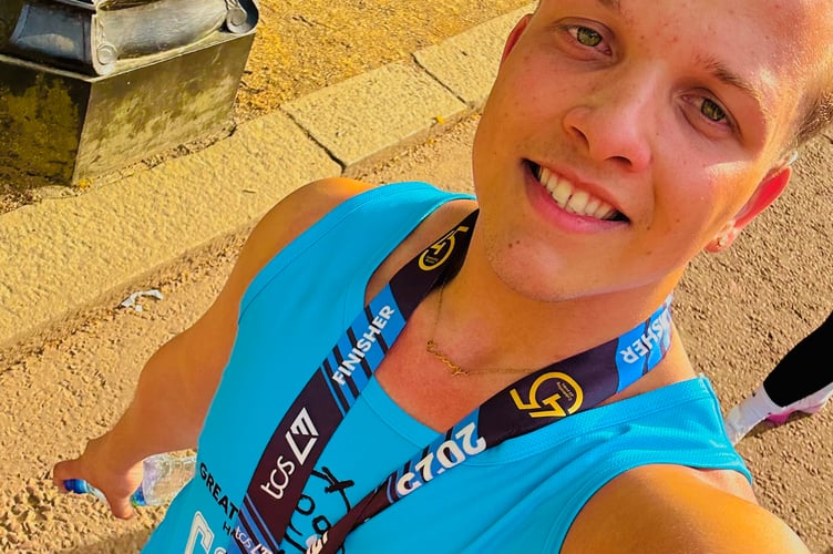 Corey Foster, a Butlin's Minehead cast member, is pictured after finishing the London Marathon.