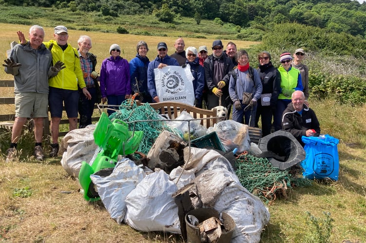 Plastic Free Exmoor volunteers pictured last year with some of the material cleared from Greenaleigh Sand, near Minehead.