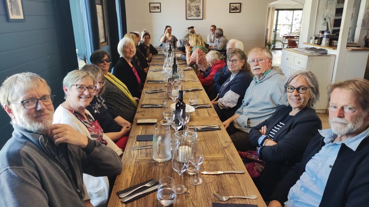 Watchet twinners prepare for a meal with their French hosts.