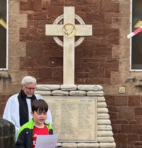 Budding young poet Joey Rammond gives a reading during Watchet's VE Day 80th anniversary commemoration. PHOTO: WTC.