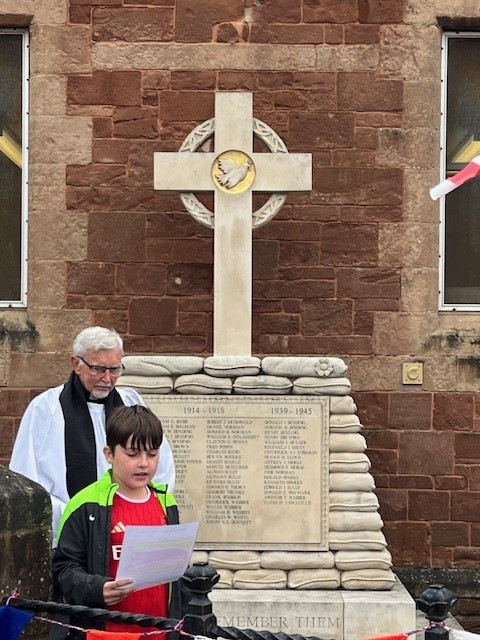 Budding young poet Joey Rammond gives a reading during Watchet's VE Day 80th anniversary commemoration. PHOTO: WTC.