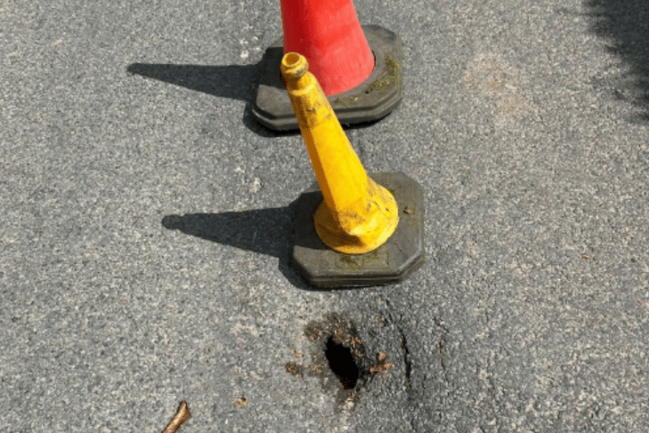 A sink hole was cordoned off on the B3190 on Exmoor but people continued to drive over it. PHOTO: Travel Somerset.