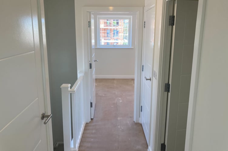 The upstairs hallway of a Rainbow Way council house, in Minehead. PHOTO: Daniel Mumby.