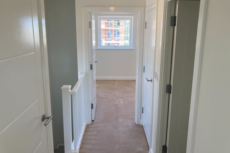 The upstairs hallway of a Rainbow Way council house, in Minehead. PHOTO: Daniel Mumby.