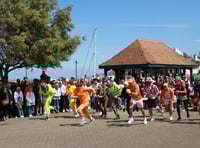 Wheelbarrow race sets town 'buzzing'