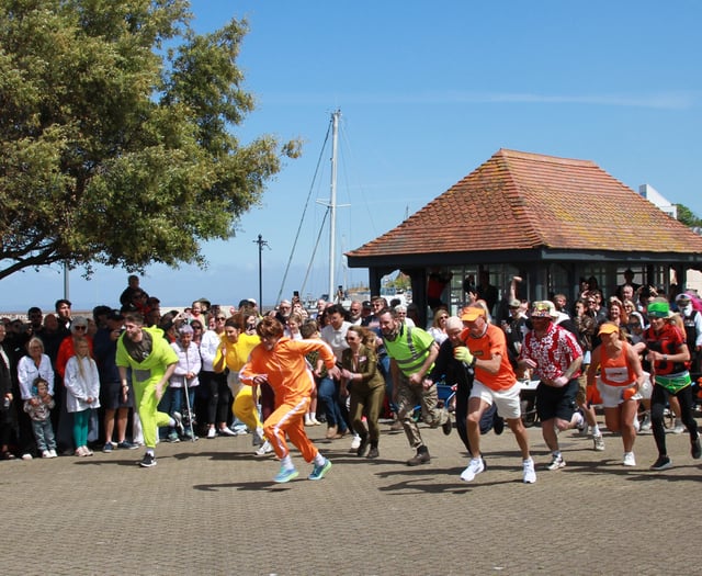Wheelbarrow race sets town 'buzzing'