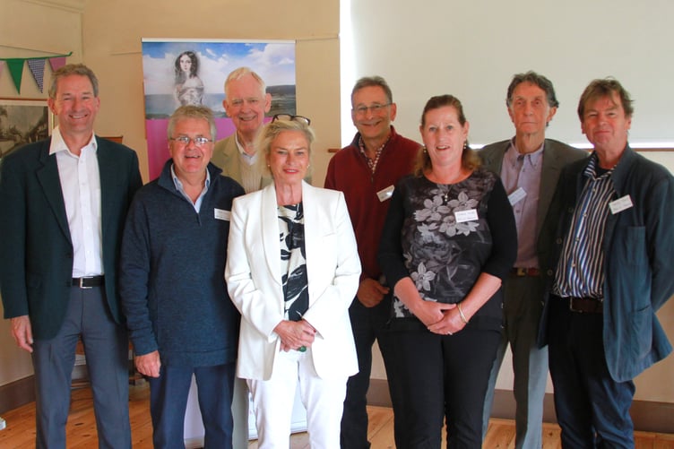 Ada in Porlock committee members (left to right) Paul Brooks, Jeff Cox, David Wardrop, Dr Stephen Colson, Kathryn Young, Duncan McCanlis, and Jeremy Payne with (front) MP Rachel Gilmour.